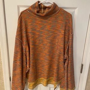 Such a great FREE PEOPLE SWEATER! Slit sides. Low turtleneck!